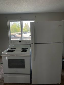 Refrigerator and electric stove in good condition.