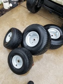 Four lawnmower tires for sale