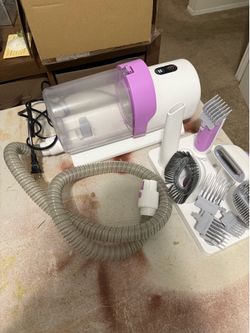 All-in-one dog grooming kit with vacuum