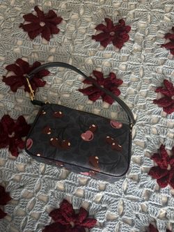 coach purse with cherries
