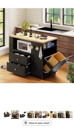 Kitchen island with trash can cabinet
