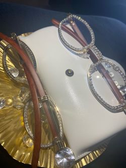 One (1) Millionaire Celebrity Italian Unisex wooden frame with sparkling lab, diamond ice trim. Comes with a white protective case for secure storage.