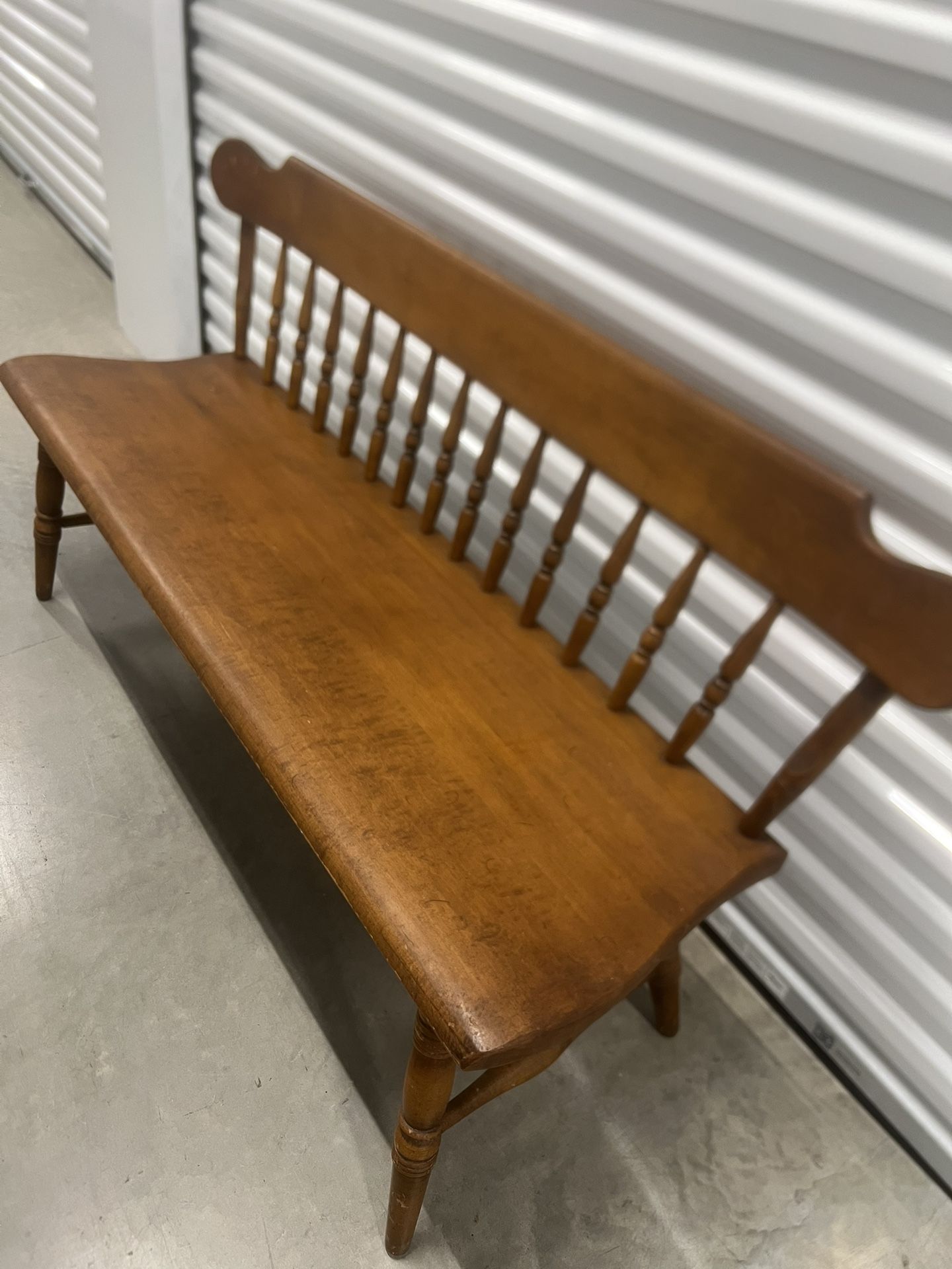 Vintage Conant Ball Maple Bench Solid Wood Spindle Back Entryway. Used in good condition with some cosmetic blemishes. These blemishes are in the fo