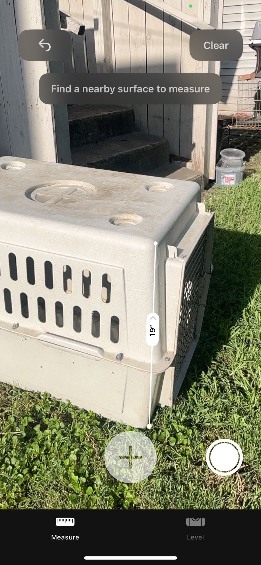 Dog Kennels Plastic One Is A Little Dirty From Being Outside & The Another Kennel Is Open From One Corner Where I Would Feed My Dog Doggy Treats.