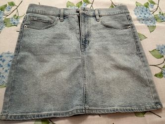 DKNY New mini denim skirt. Size 30 waist. Has tiny rhinestones on the front.