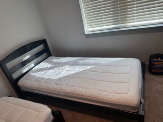 Two twin beds with mattresses