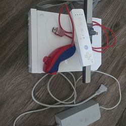Nintendo wii with Wii game party 3 and nunchuk remote batteries included