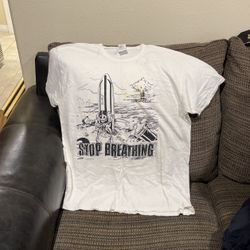 Size large, vintage, stop breathing surfer T-shirt.