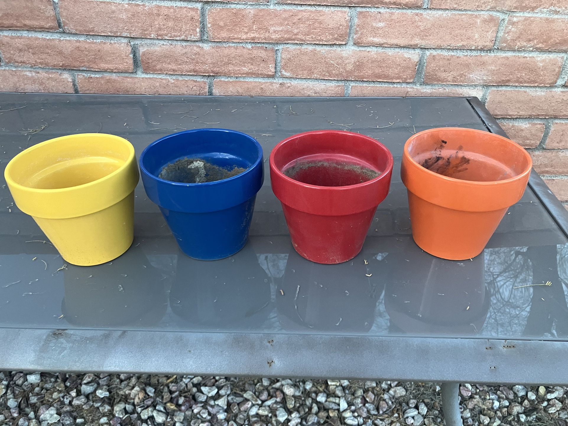 Set Of Four Colored Flower Pots