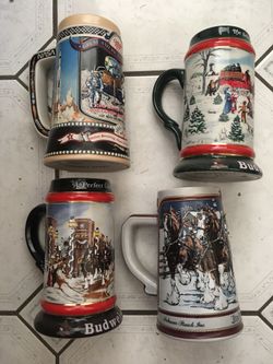 Budweiser and Miller steins