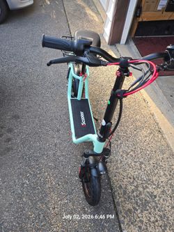 Scooter with seat and basket 12 inch pneumatic tires and front and rear suspension BRAND NEW
