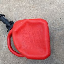 1 gallon plastic gas can with 2 tablespoons of liquid in it