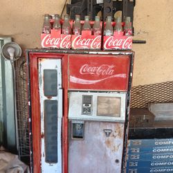 Coca cola machine with coca cola bottles