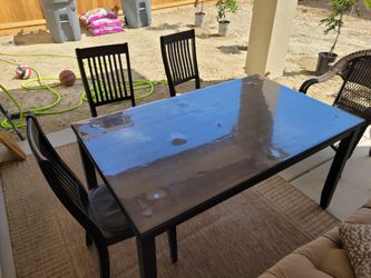 For Free.   Kitchen table and 3 chairs for free.