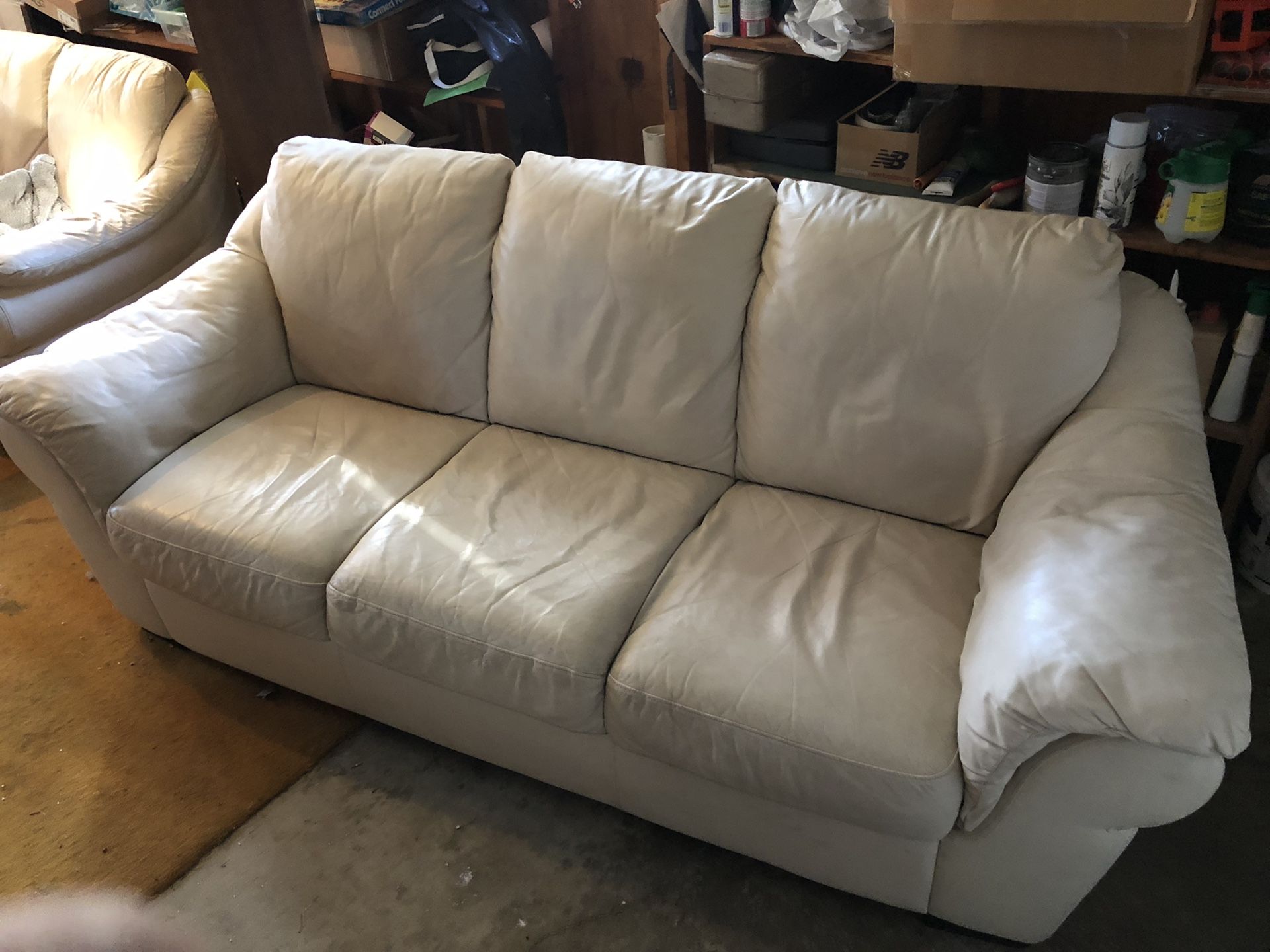 White leather couch and love seat
