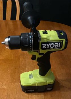 RYOBI One + 18V Brushless Cordless 1/2 Hammer Drill. Comes with battery & charging box.