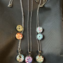 (D) Three Stainless Steel Necklaces With Seven Snapping Charms