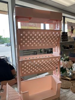 Cute pink organizer on wheels for the kids room