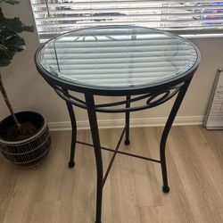 Modern round glass-top bistro table