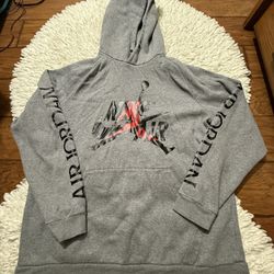 gray Air Jordan brand hoodie featuring the "Jumpman" logo graphic.  XL on tag