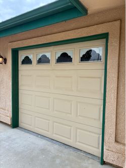 Garage Doors! 2 single car, one with windows one without.
