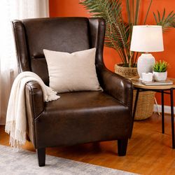 Brown leather wingback chair nailhead Trim