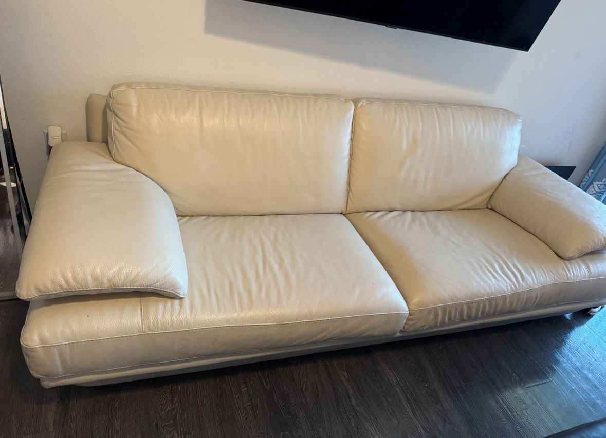 Leather cream sofa by Natuzzi