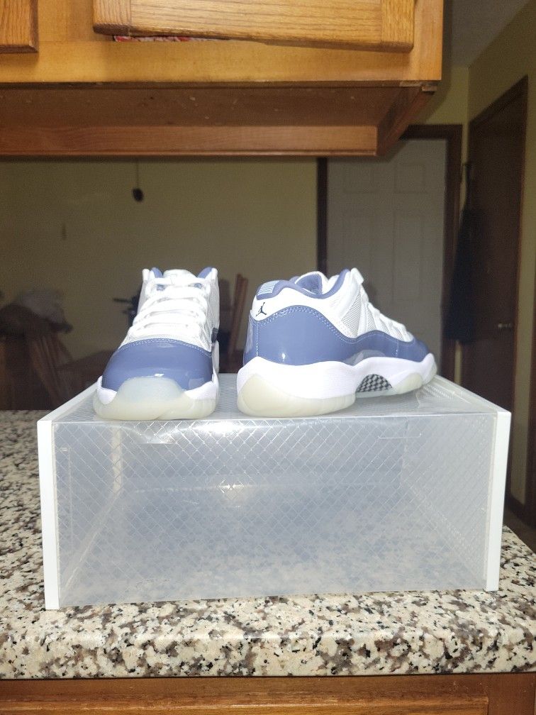 Air Jordan 11 Retro Low in the "Diffused Blue" or "Midnight Navy" colorway.