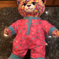 Build A Bear Workshop Teddy Bear Wearing a Pair if cute one piece pajamas .  .  Very cute.  Size 15 inches tall.  Preowned excellent condition.  Only 