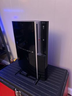 PS3 with games and controller.
