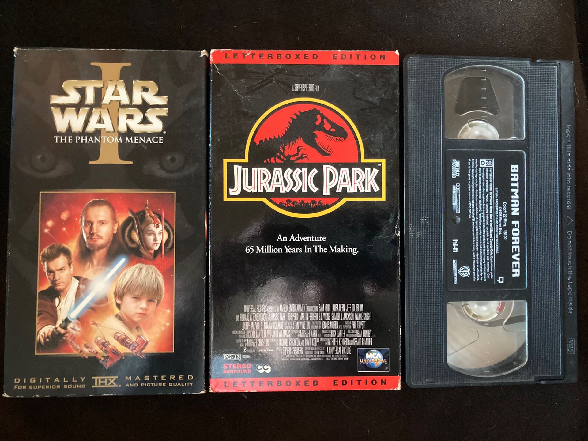 3 VHS Tapes- Star Wars Phantom Menace, Jurassic Park, And Batman Forever