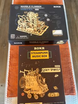 two ROKR 3D wooden puzzle and model building kits: