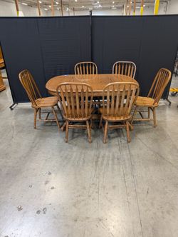 Oak Finish Dining Table with Six  Spindle Back Chairs