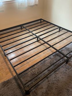 King size bed frame - barely used.  75.00 obo