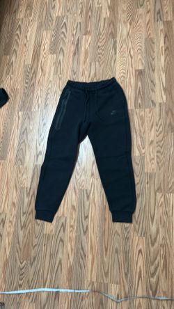 Black Nike tech pants