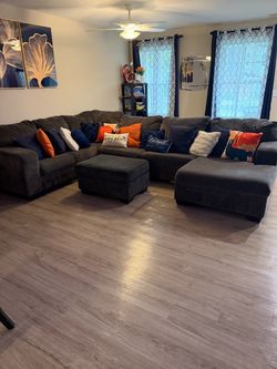 Ashley Furniture Sectional- “Large Charcoal Gray Sectional Sofa + Ottoman + Decorative Pillows – Excellent Condition