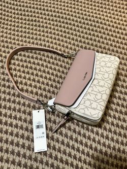 Elegant Calvin Klein crossbody with blush and ivory tones. Perfect for versatile styling.