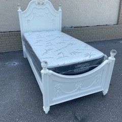 White twin-size Disney princess bed frame with brand-new twin-size plush mattress and box spring in plastics 