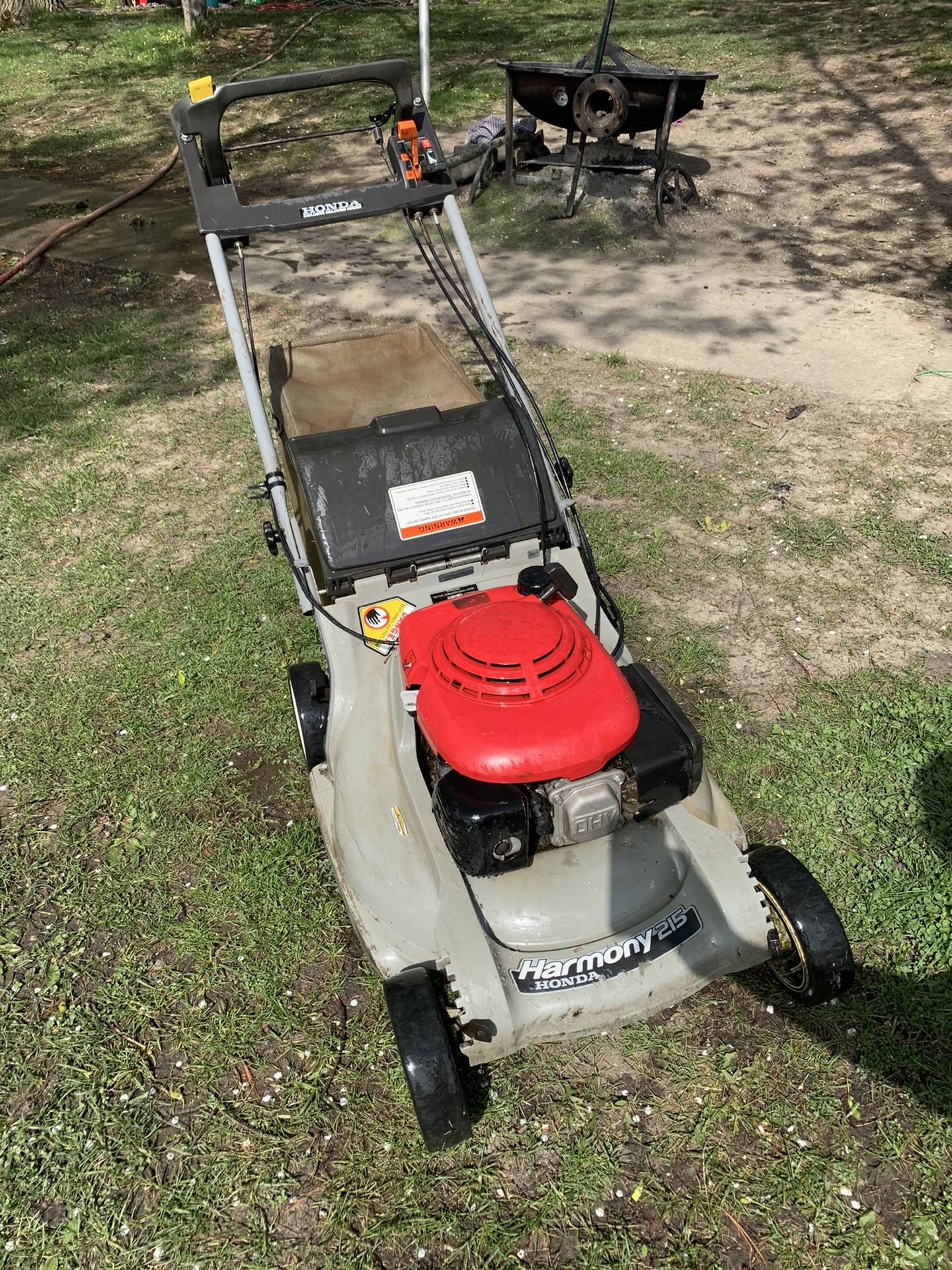 Honda Harmony 215 self propelled lawn mower with bagger and mulching plug. Starts right up and cuts. 2 self propelled speeds. Self propelled takes a