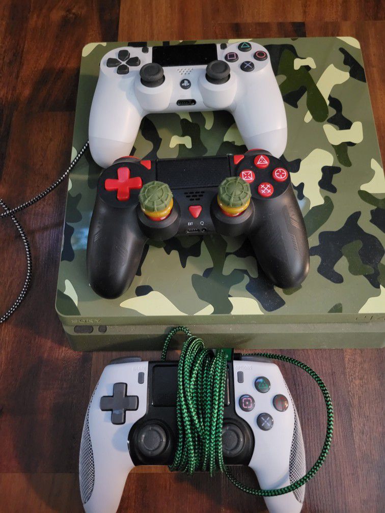PS4 , Headphones, camera and Three Controllers 