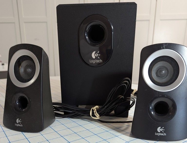 Logitech Speakers and one Bluetooth Speaker