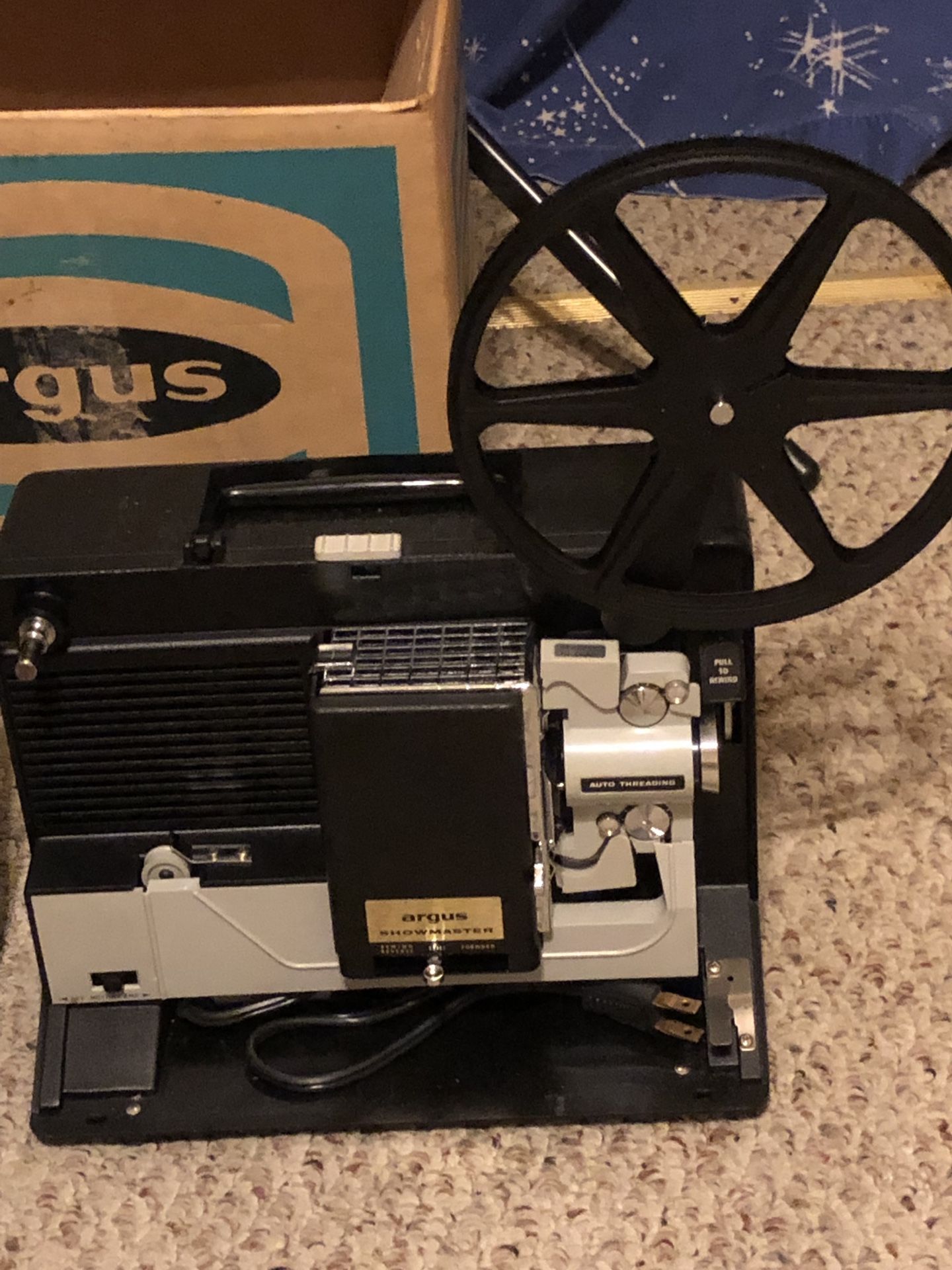 8 mm Argus Showmaster movie projector and screen.