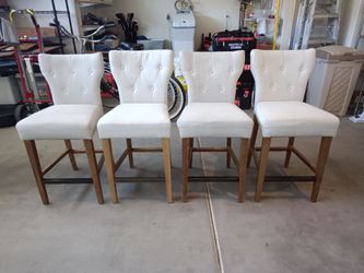 4 cream fabric counter height stools