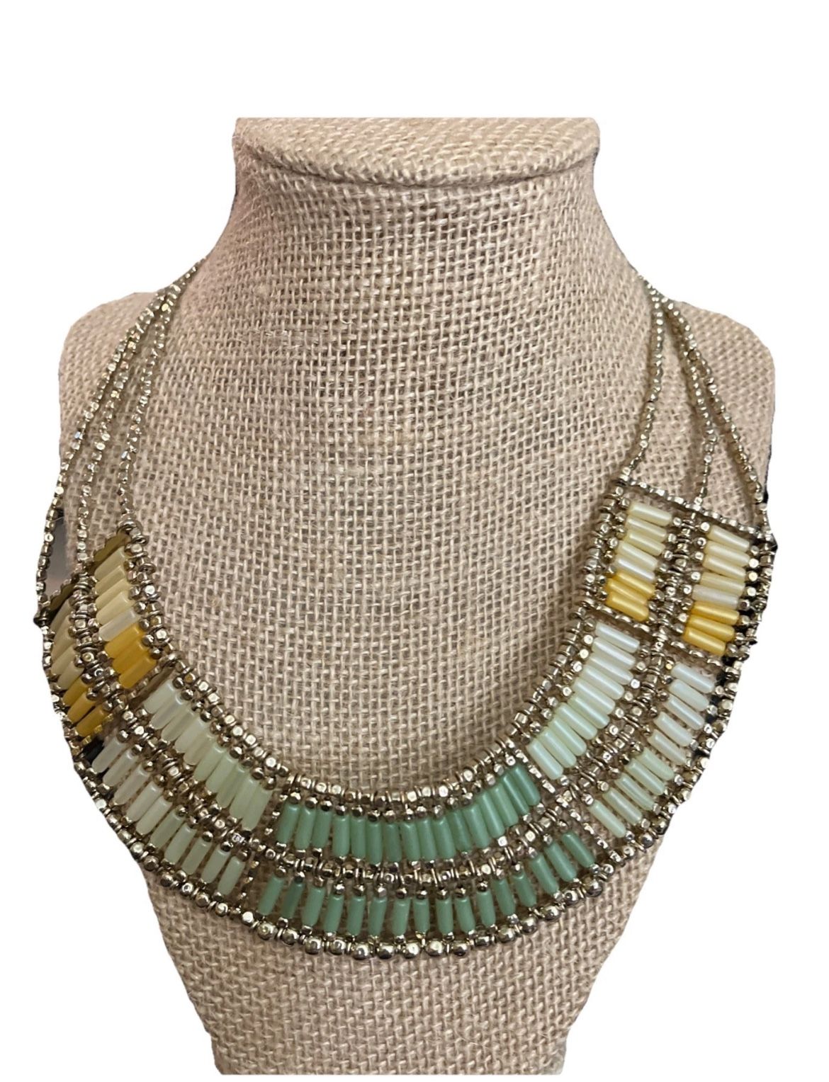 Elevate your jewelry collection with this stunning Chico's 3 Strand Statement Necklace. The gold-tone big oval beads are the perfect addition to your