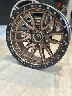 Brand new fuel Rebel D681 17x9 -12 6x135 bronze black lip with 285/70r17 all terrain tires available in stock