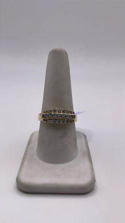 14k golld ring with CZ in front of the band