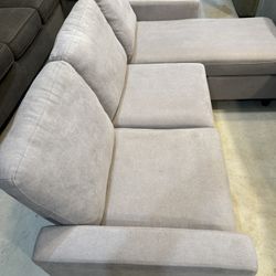 Gray sectional couch with Chase