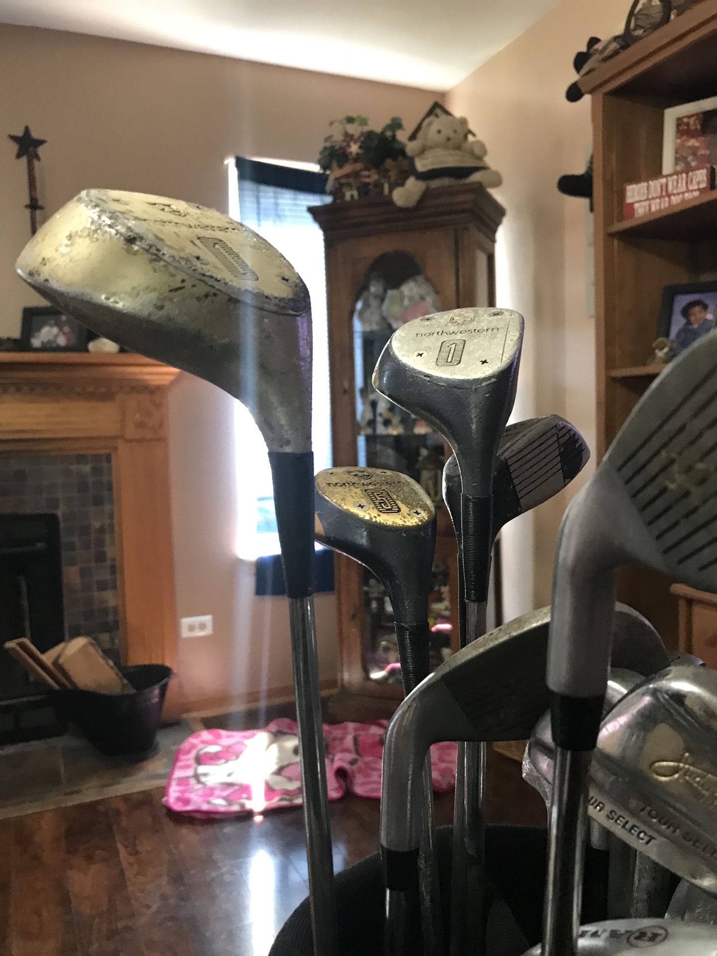 Assorted golf clubs