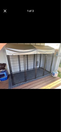Heavy metal kennel dog pet run kept under cover
