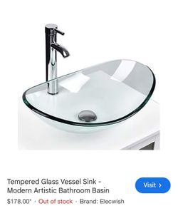 Glass oval bowl above the sink fixture